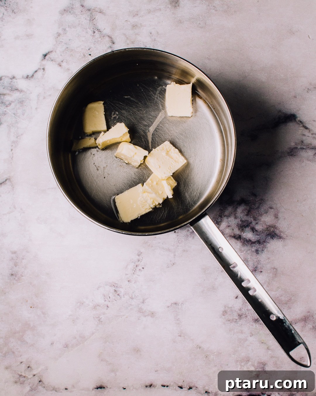 Airy French Doughnuts 5 Saucepan with water, butter, sugar, and salt boiling for choux pastry