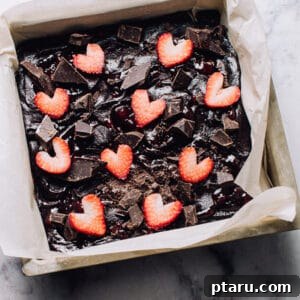Ruby Red Brownie Bliss 6 Strawberry Brownie Batter in a pan, showcasing the pre-baked texture and rich color.
