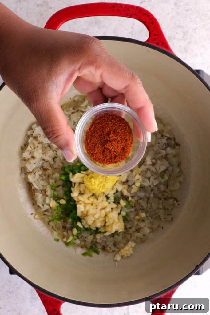 Aromatic Madras Lentil Curry 5 adding cayenne powder and the remaining spices to the pot