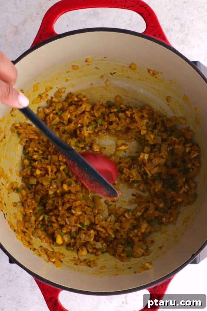 Aromatic Madras Lentil Curry 6 adding tomato paste on the spices and aromatics in the pot