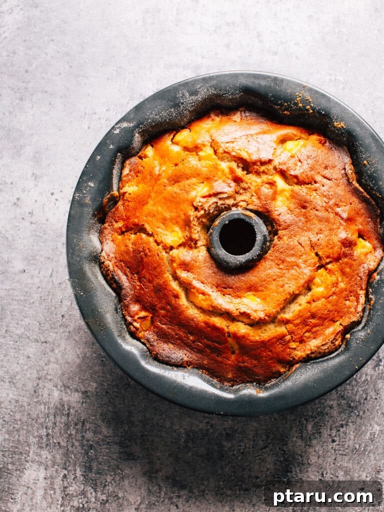 Grandma's Peach Cobbler Pound Cake 7 Close-up of a slice of moist Peach Cobbler Pound Cake