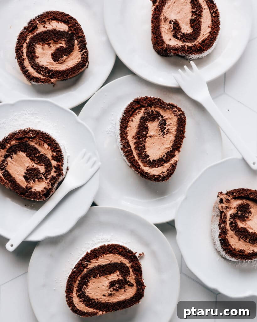 Decadent Chocolate Swiss Roll 3 Ingredients laid out for making the Swiss roll cake, including eggs, sugar, cocoa, and cream.