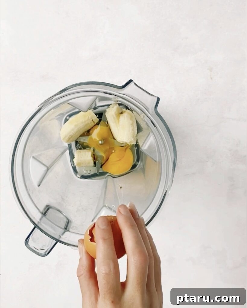Three Ingredient Banana Pancake Delight 4 Blender with the banana pancake ingredients.