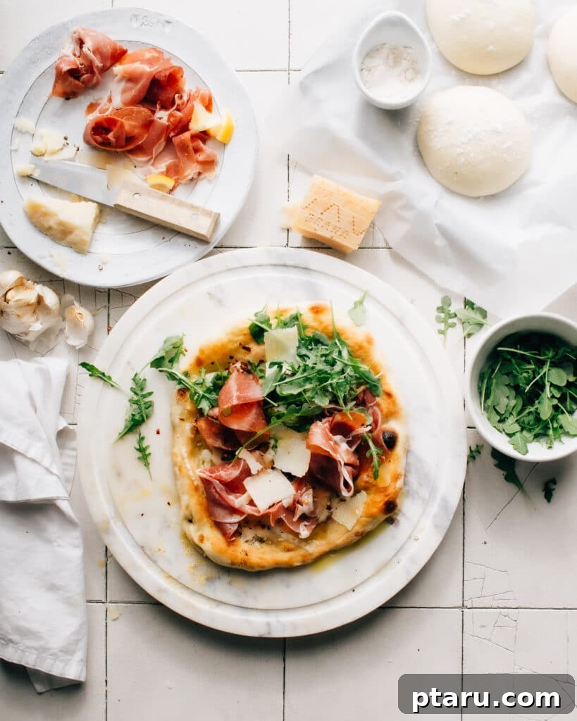 Parma Prosciutto, Arugula and Shaved Grana Padano Pizza 5 Finished Prosciutto di Parma Pizza ready to serve