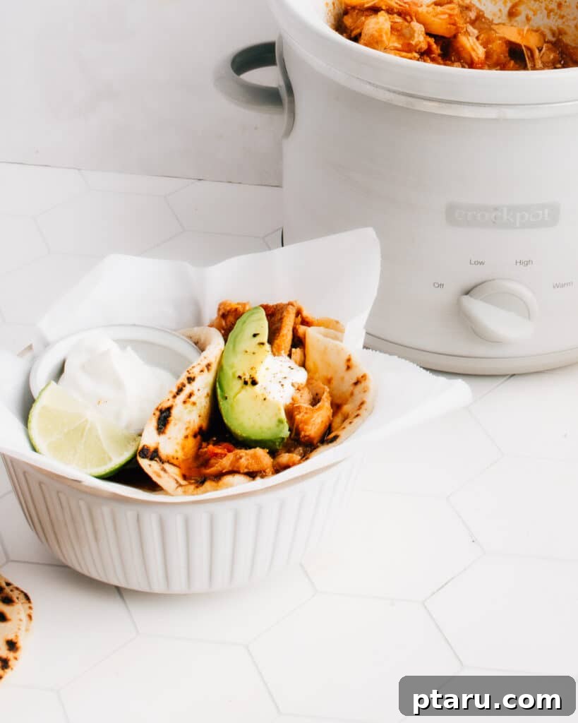 Effortless Crockpot Chicken Tacos 2 These easy Shredded (or pulled) Chicken Tacos are cooked in a crockpot with the best, crazy-delicious sauce. You don't want to miss my tips for the best way to shred chicken, plus a comprehensive list of yummy chicken taco toppings. A slow cooker makes this healthy recipe super simple and hands off.