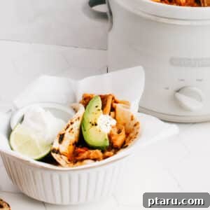 These easy shredded (or pulled) chicken tacos are cooked in a crockpot with a delicious sauce, and are perfect for any time of the year.