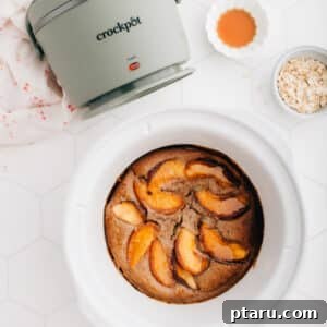 A visually appealing square image of the finished Overnight Crockpot Slow Cooker Baked Oats with fresh peaches, ready to be served.