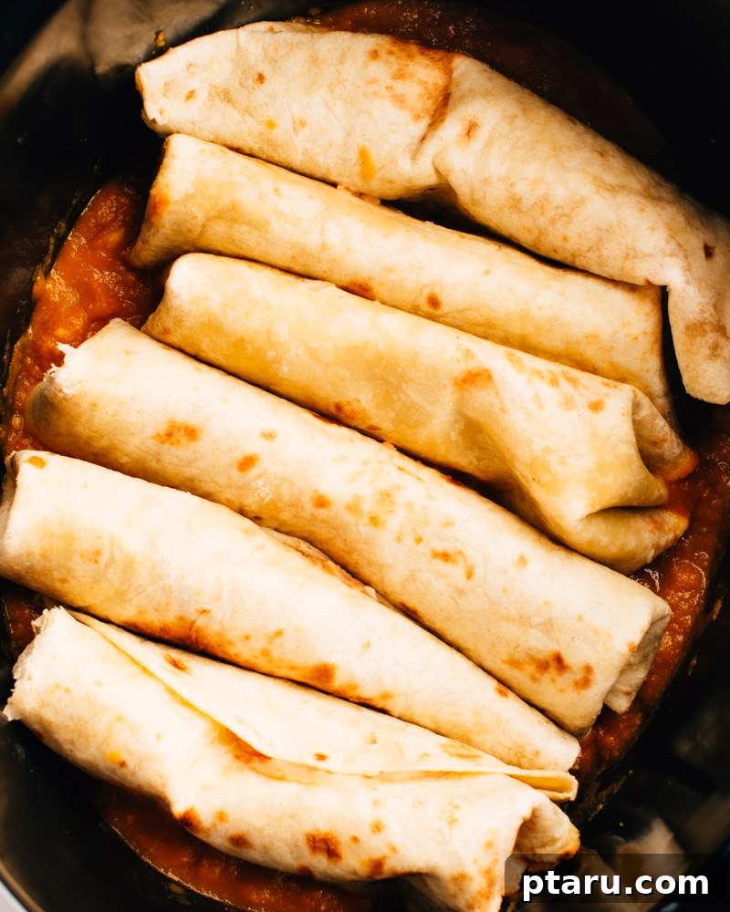 Autumn Harvest Chicken Enchiladas with Spiced Pumpkin Sauce 7 How to arrange enchiladas in crockpot slow cooker