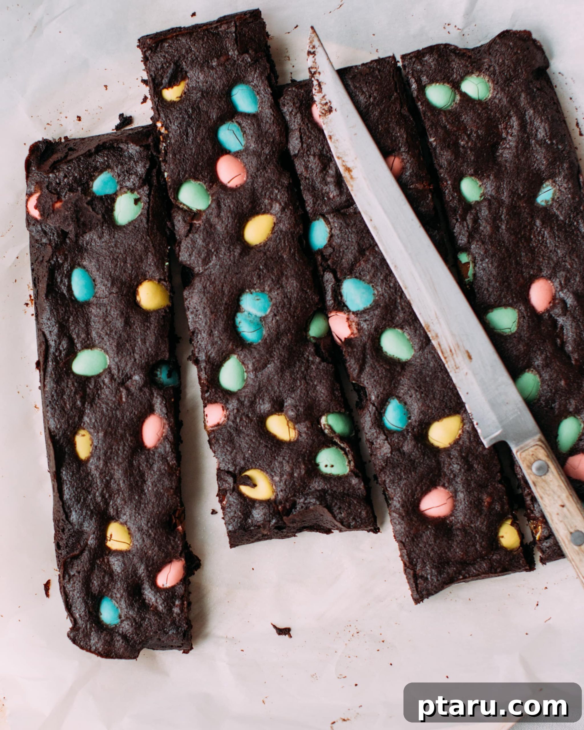 Hoppy Easter Brownies 2 Easter brownies sliced into long strips with easter eggs on them.