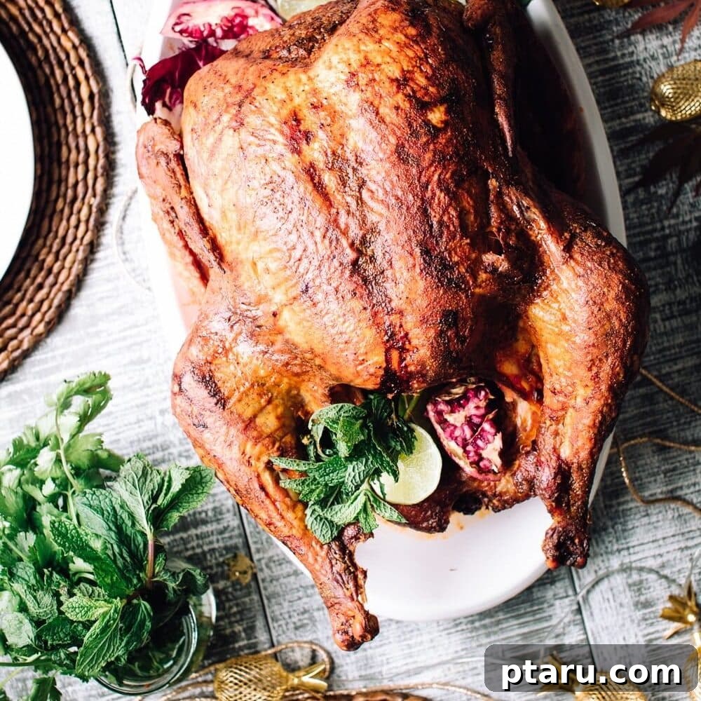 Thanksgiving Dinner Made Simple: Your Stress-Free Timeline 4 Tandoori Turkey Recipe by Foodess, showing a beautifully roasted turkey with vibrant spices.