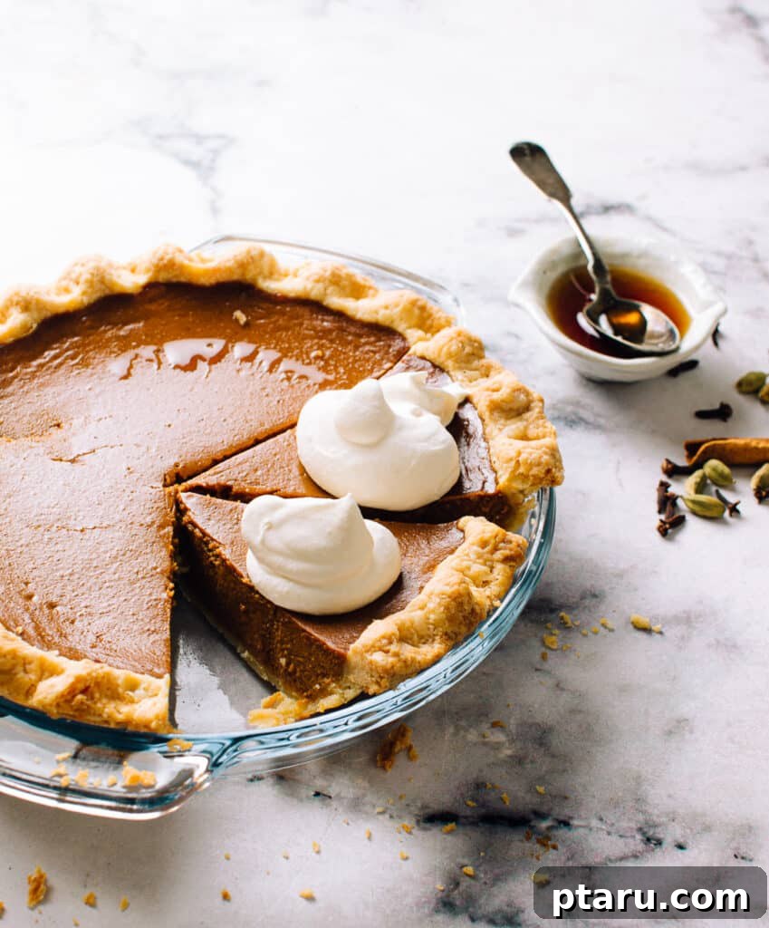 Thanksgiving Dinner Made Simple: Your Stress-Free Timeline 5 Homemade Pumpkin Pie photo, showing a classic Thanksgiving dessert with whipped cream.
