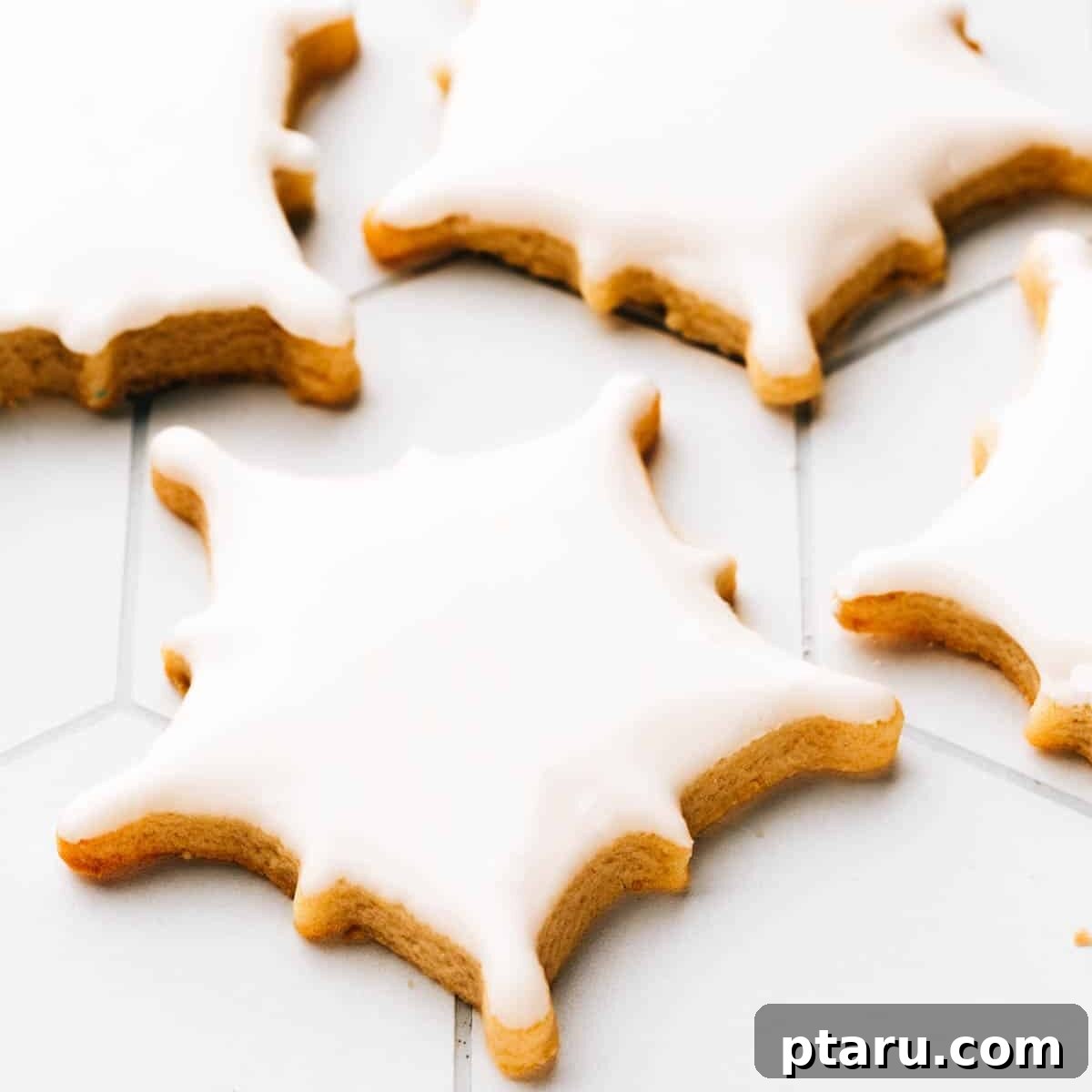 Glistening Snowflakes 8 Snowflake cookies simply decorated with a smooth layer of royal icing, looking elegant and festive.