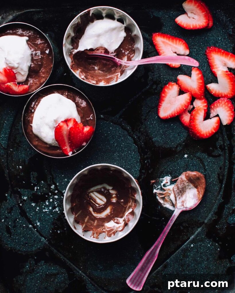 20 Deliciously Easy Chocolate Christmas Desserts 13 A generous bowl of Salted Double Chocolate Pudding, beautifully garnished with fresh sliced strawberries on top.