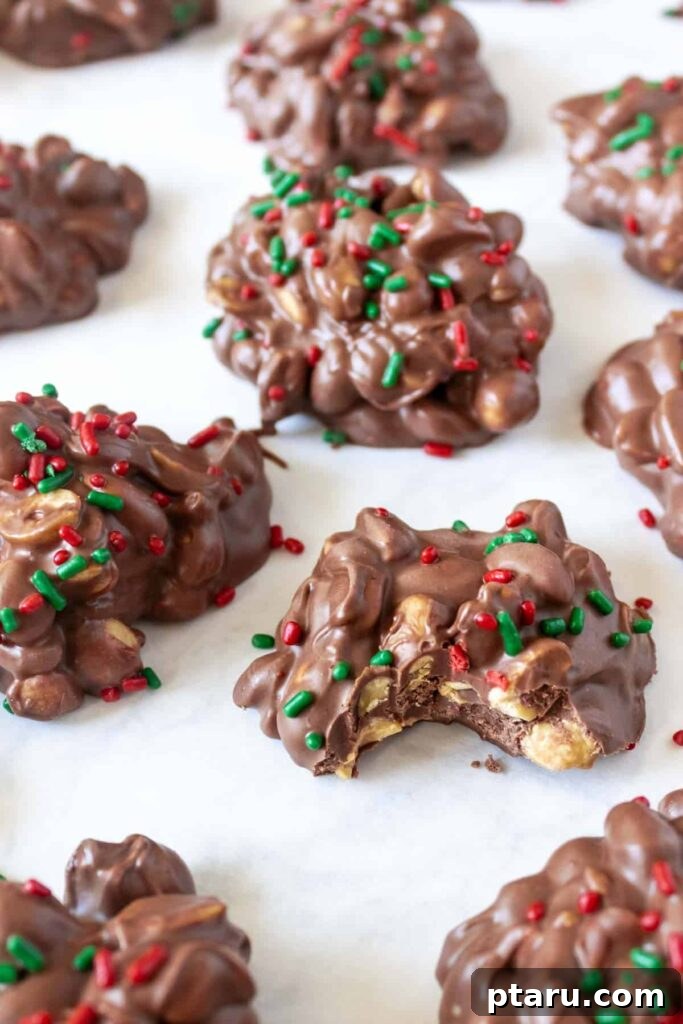 20 Deliciously Easy Chocolate Christmas Desserts 16 A festive display of Crockpot Christmas Candy, adorned with colorful sprinkles, perfect for holiday gatherings.