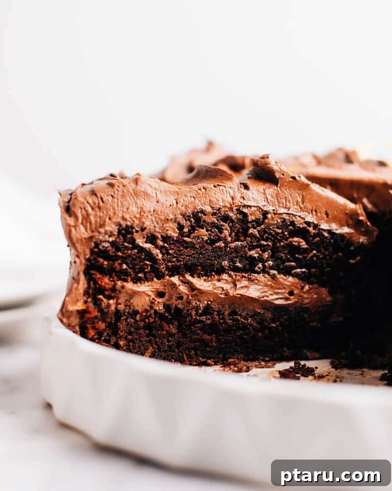 20 Deliciously Easy Chocolate Christmas Desserts 17 A beautifully sliced piece of Moist Chocolate Cake, revealing its rich, tender interior.
