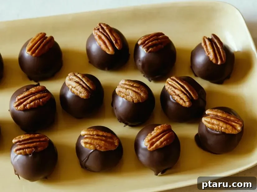 Effortless Festive Bites: 15+ No-Bake Christmas Sweets 11 No-bake Bourbon Balls with pecans on top