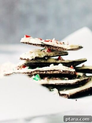 Effortless Festive Bites: 15+ No-Bake Christmas Sweets 13 candy cane bark piled high on a piece of parchment