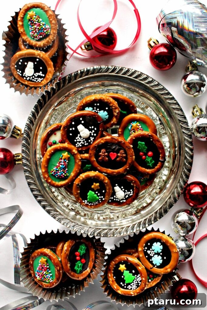 Effortless Festive Bites: 15+ No-Bake Christmas Sweets 18 Decorated No-bake Christmas pretzels on a platter.