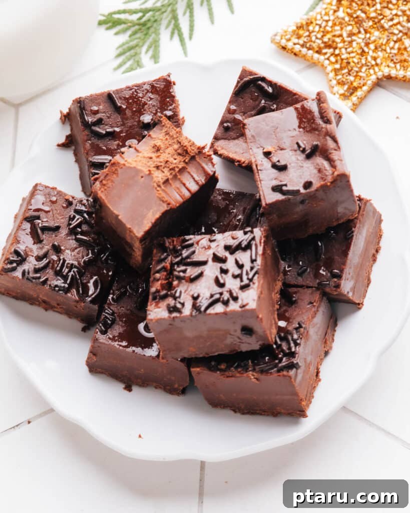 Effortless Festive Bites: 15+ No-Bake Christmas Sweets 3 Fudge pieces in white plate