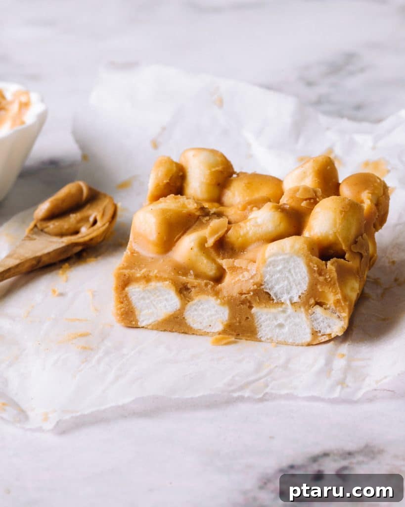 Effortless Festive Bites: 15+ No-Bake Christmas Sweets 4 No-bake Peanut Butter Butterscotch Bar on a parchment paper.