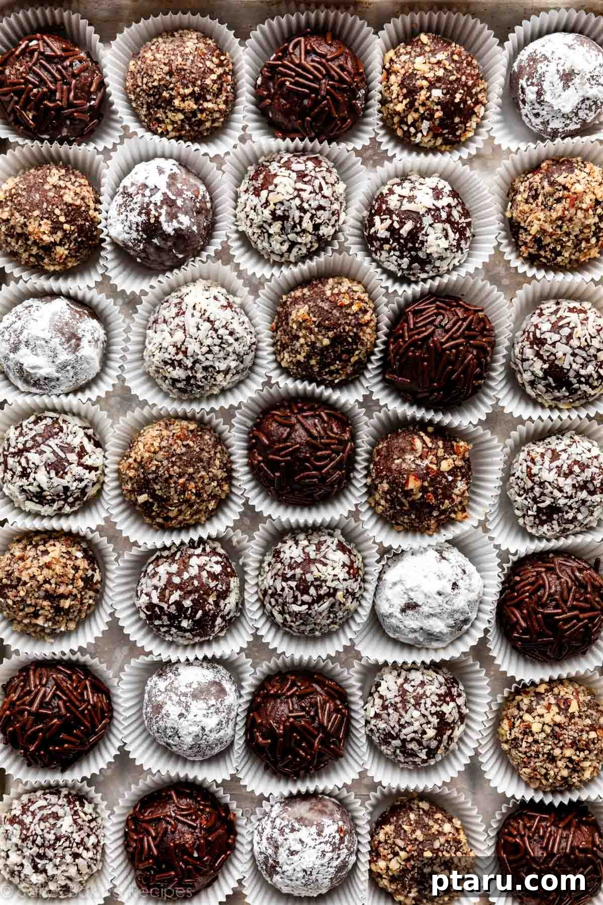 Effortless Festive Bites: 15+ No-Bake Christmas Sweets 10 No Bake Christmas treat recipe for rum balls in little paper cups.