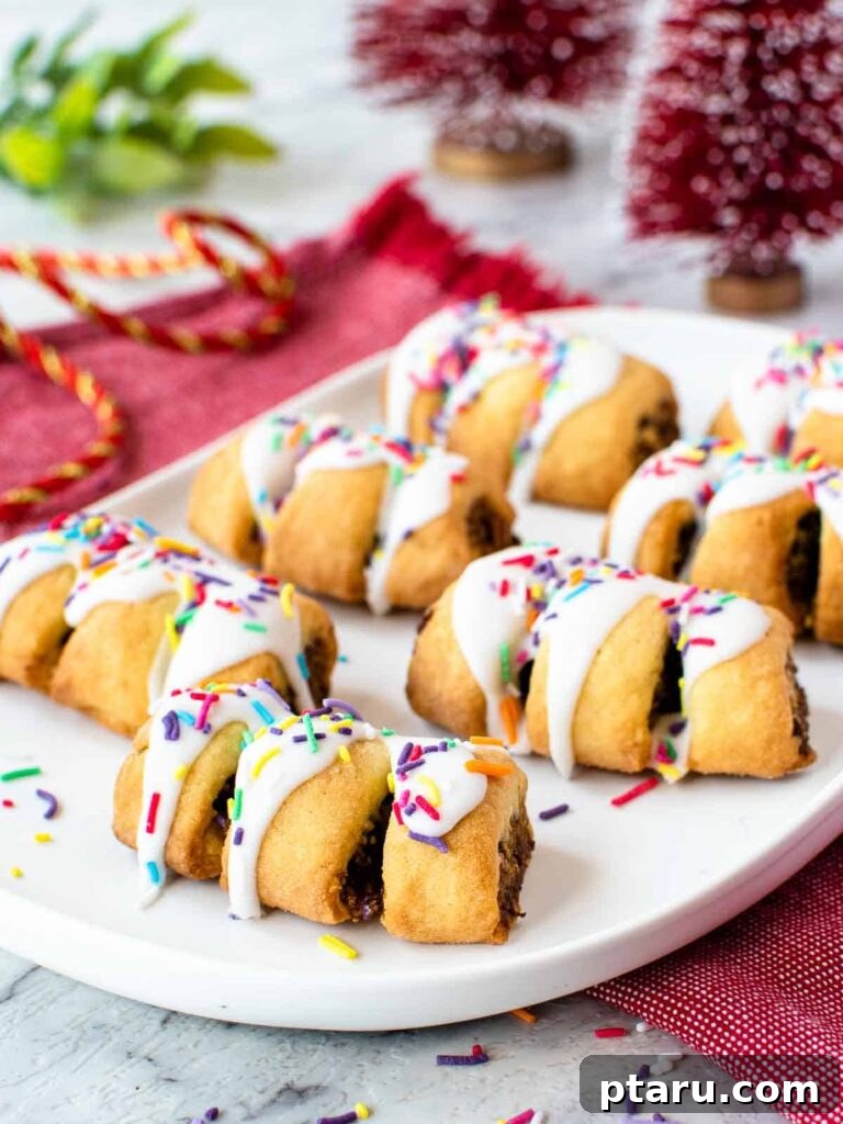 15 Irresistible Italian Desserts to Sweeten Your Christmas 16 Beautifully decorated Italian fig cookies (Cuccidati) arranged on a plate, showcasing their festive designs and inviting texture, a classic Christmas treat.