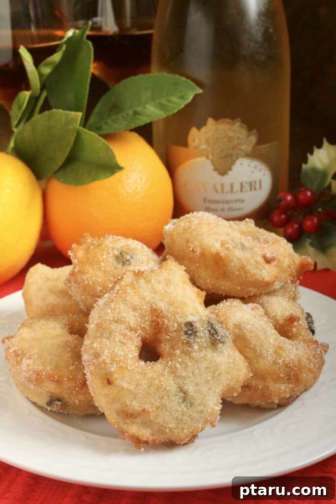 15 Irresistible Italian Desserts to Sweeten Your Christmas 6 A festive stack of golden-brown Zeppoles, lightly dusted with powdered sugar, invitingly arranged on a plate, embodying the simplicity and deliciousness of Italian Christmas Eve traditions.