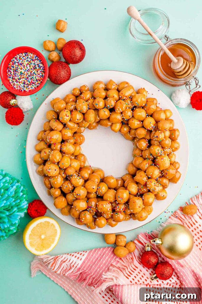 15 Irresistible Italian Desserts to Sweeten Your Christmas 9 A festive mountain of glistening honey balls (Struffoli), generously topped with colorful rainbow sprinkles, creating a joyful and traditional Italian Christmas centerpiece.