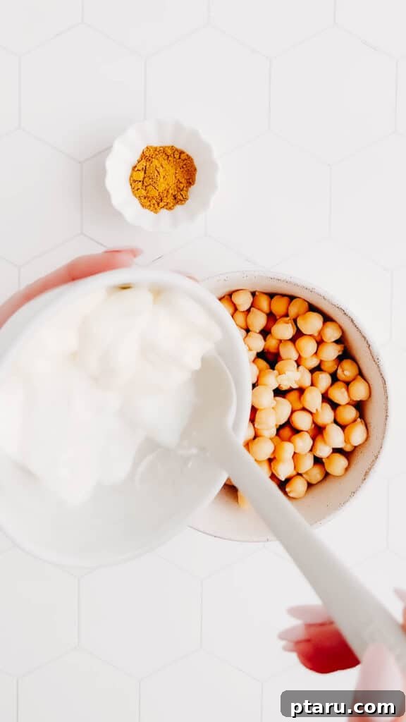 Velvety Indian Chana Salad 3 Adding yogurt and mayonnaise to a bowl of Indian Chickpea Salad ingredients.