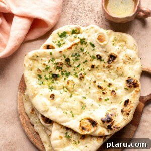 Soft Butter Naan 8 Warm butter naan with a dish of melted butter and cilantro.
