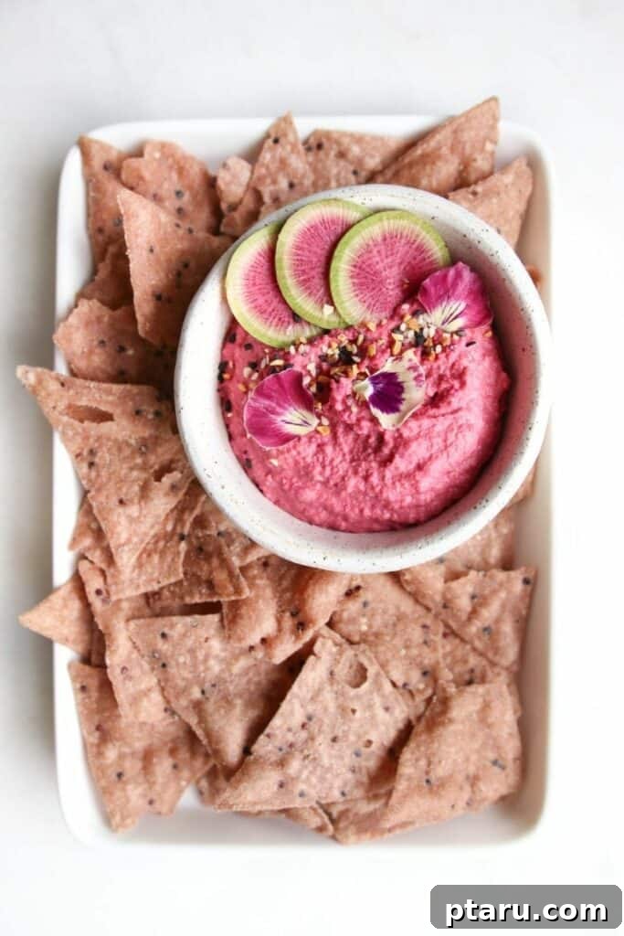 14+ Stress-Free & Delicious Valentine's Family Dinners 13 Bowl of garlic beet hummus served with crunchy potato chips for dipping