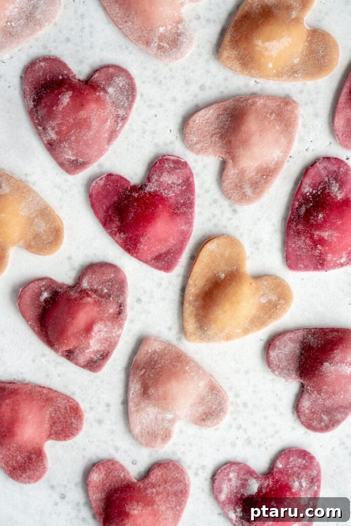 14+ Stress-Free & Delicious Valentine's Family Dinners 16 Beet Heart Ravioli arranged on a white marble background