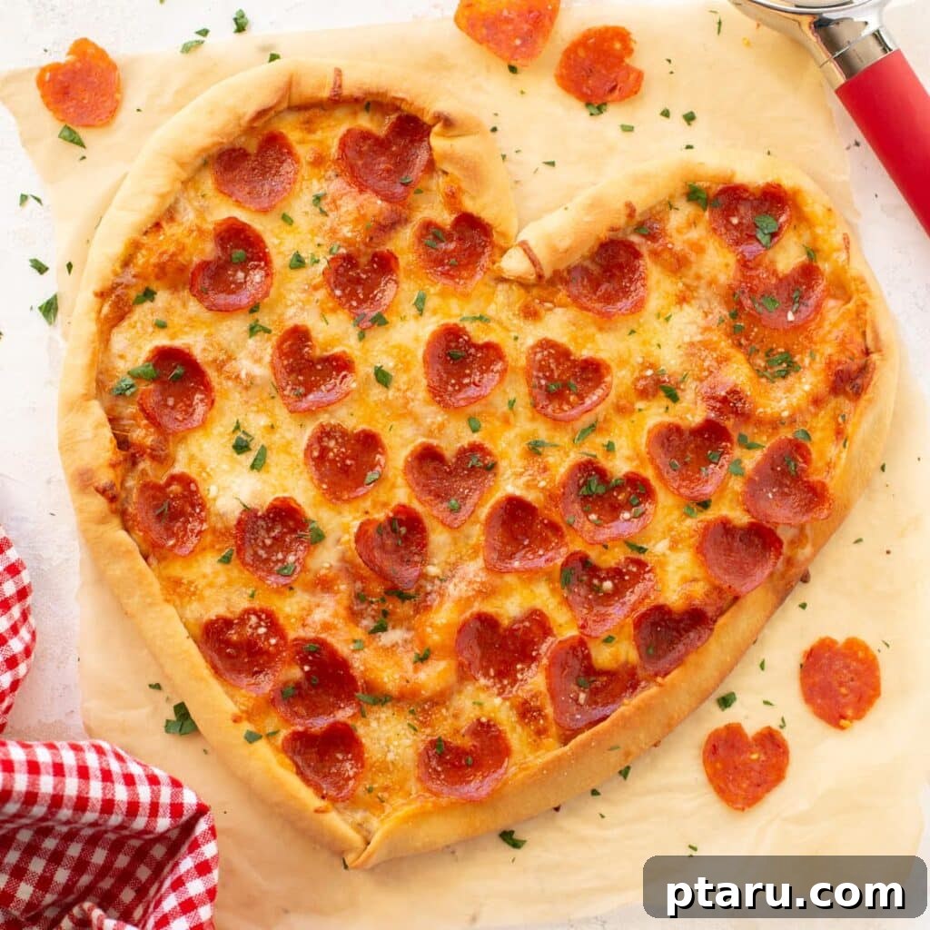 14+ Stress-Free & Delicious Valentine's Family Dinners 20 Heart-shaped pizza topped with melted cheese and pepperoni