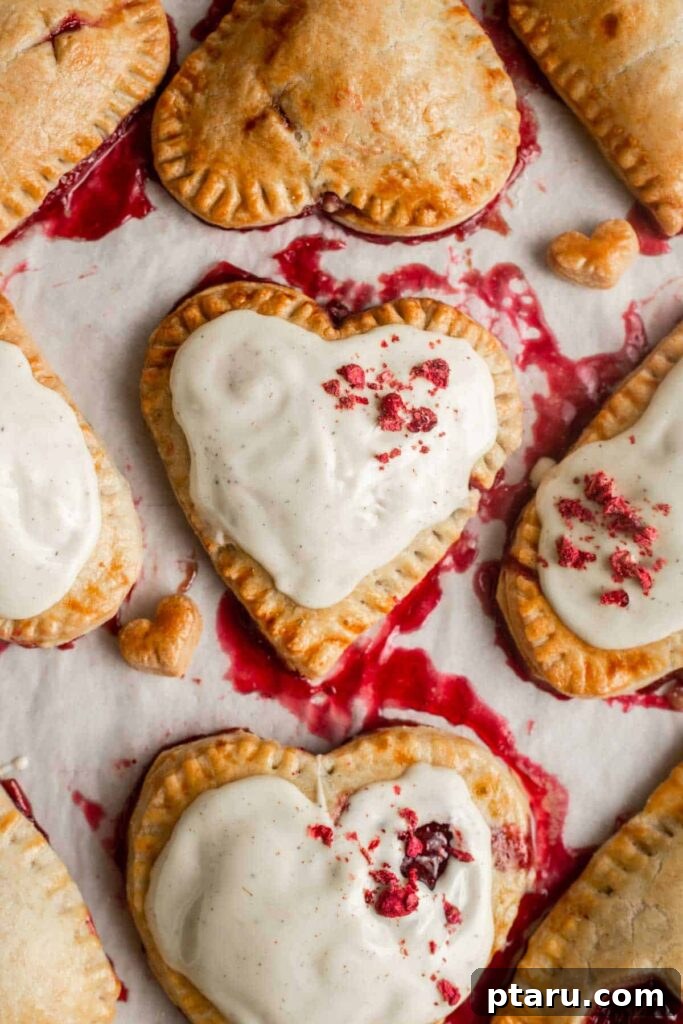 14+ Stress-Free & Delicious Valentine's Family Dinners 22 Valentine's Day Raspberry Hand Pies drizzled with white chocolate