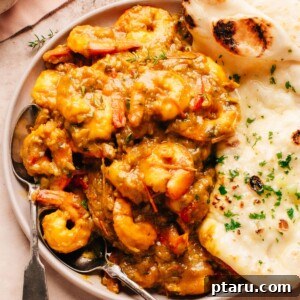 Island Soul Shrimp Curry 8 Jamaican Curry Shrimp on a plate with naan bread.