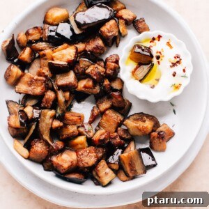 Perfectly Crispy Air-Fried Eggplant 7 Air Fryer eggplant on a plate with a dip.