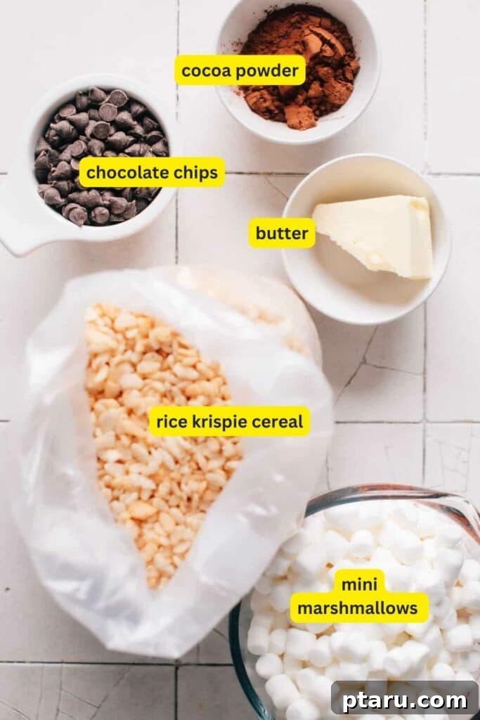 Decadent Chocolate Crunch Bars 3 Ingredients for Chocolate Rice Krispie Treats laid out on a kitchen countertop, including, cocoa powder, chocolate chips, butter, mini marshmallows and rice krispie cereal.
