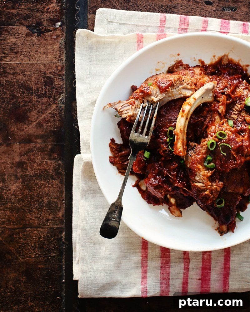Sweet and Smoky Cranberry-Chipotle Ribs 3 Rich, homemade cranberry chipotle BBQ sauce simmering in a saucepan.