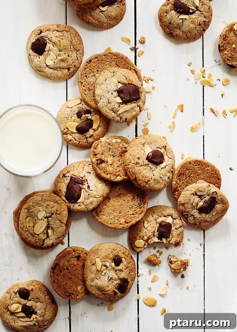 Decadent Chocolate Chunk Almond Cookies 3 Ingredients for Chocolate Chunk Almond Cookies laid out: butter, sugars, eggs, flour, chocolate, almonds, extracts