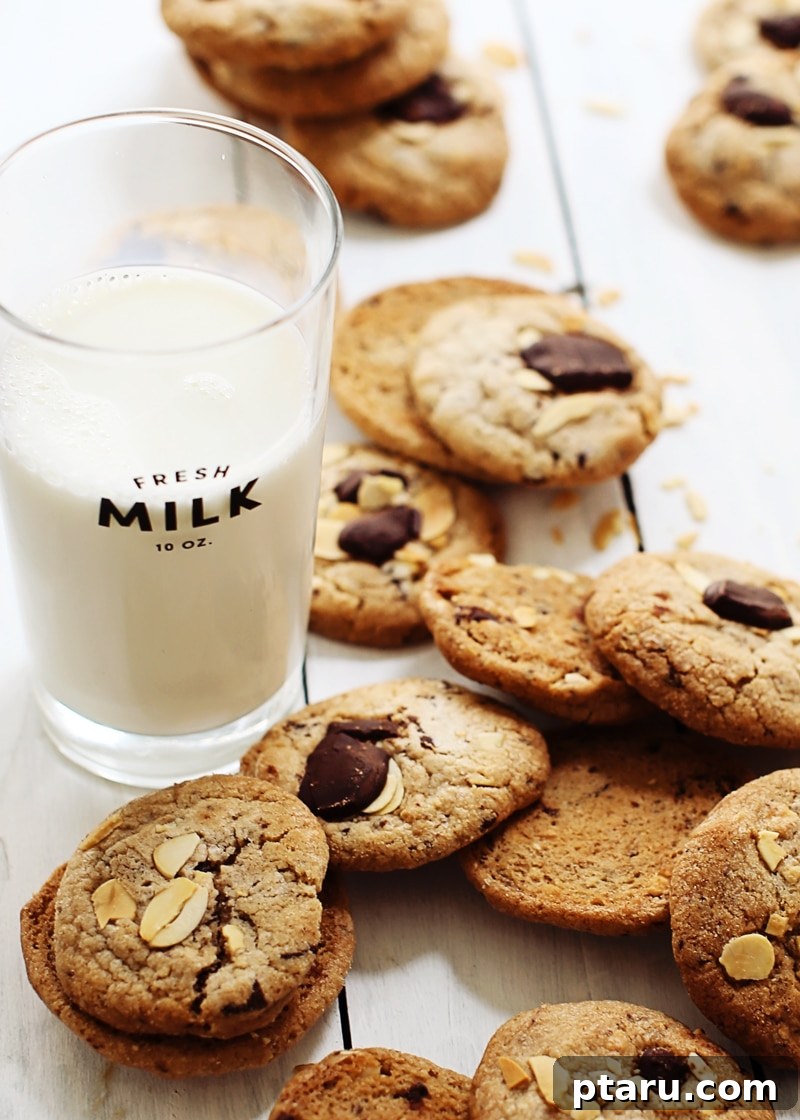 Decadent Chocolate Chunk Almond Cookies 4 A close-up of a perfectly baked Chocolate Chunk Almond Cookie, showcasing its texture and ingredients