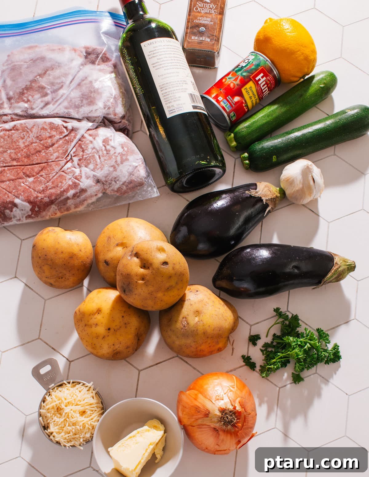 Hellenic Shepherds Pie 3 Ingredients for Greek Shepherd's Pie laid out, showing vegetables, meat, and spices