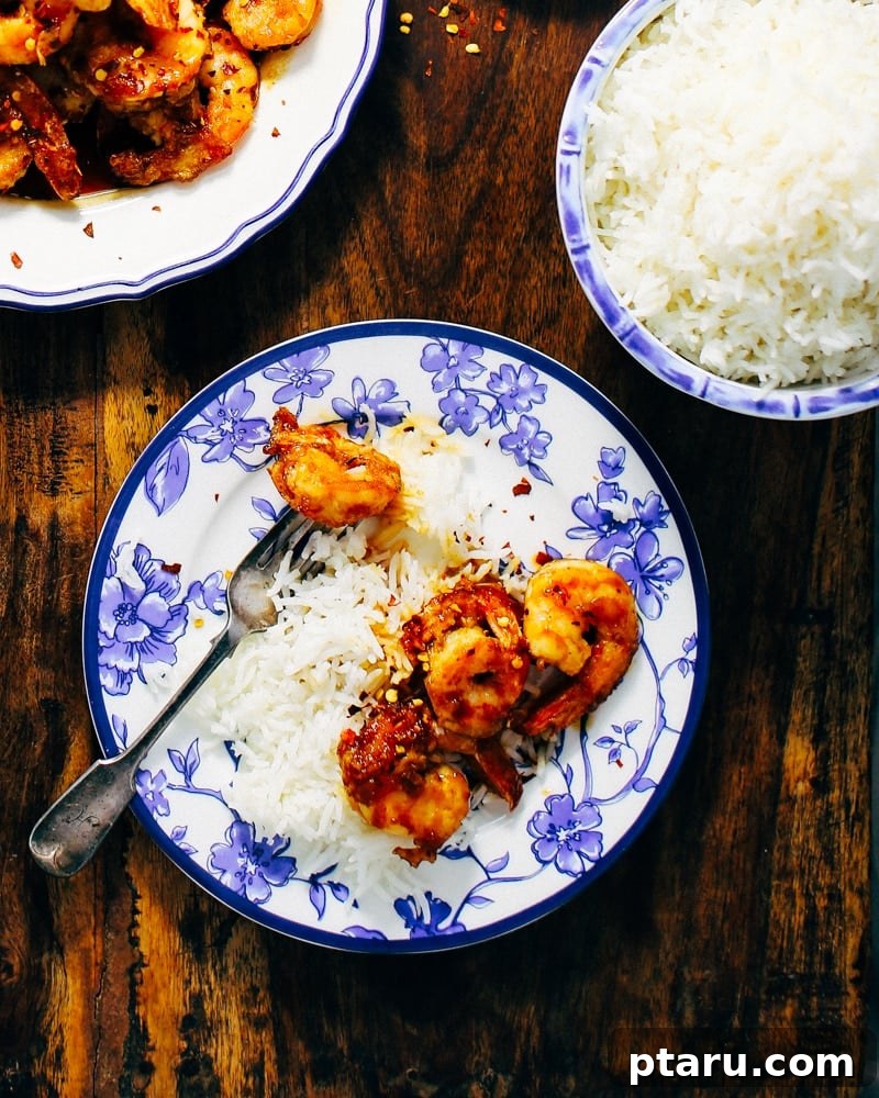 Golden Honey-Orange Glazed Shrimp 2 Vibrant Crispy Honey-Orange Fried Shrimp garnished with fresh herbs