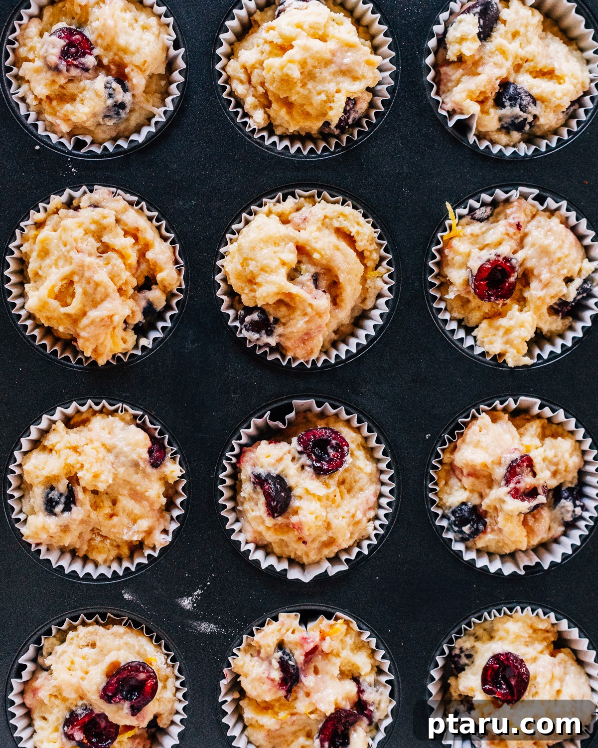 Luscious Cherry Muffins 7 Cherry muffin batter in muffin tin, ready for baking.