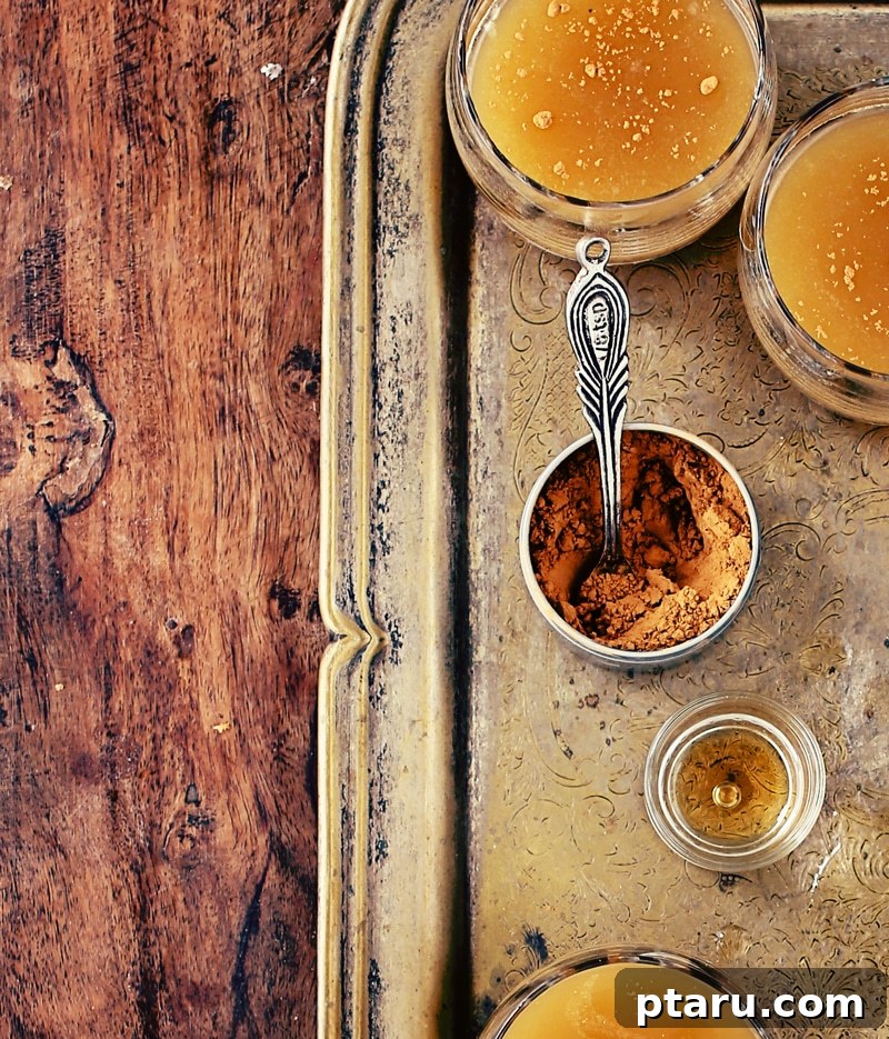 Yuletide Apple Glow 3 Close-up of a Spiced Apple Bourbon Cocktail with ice and a star-shaped apple garnish.