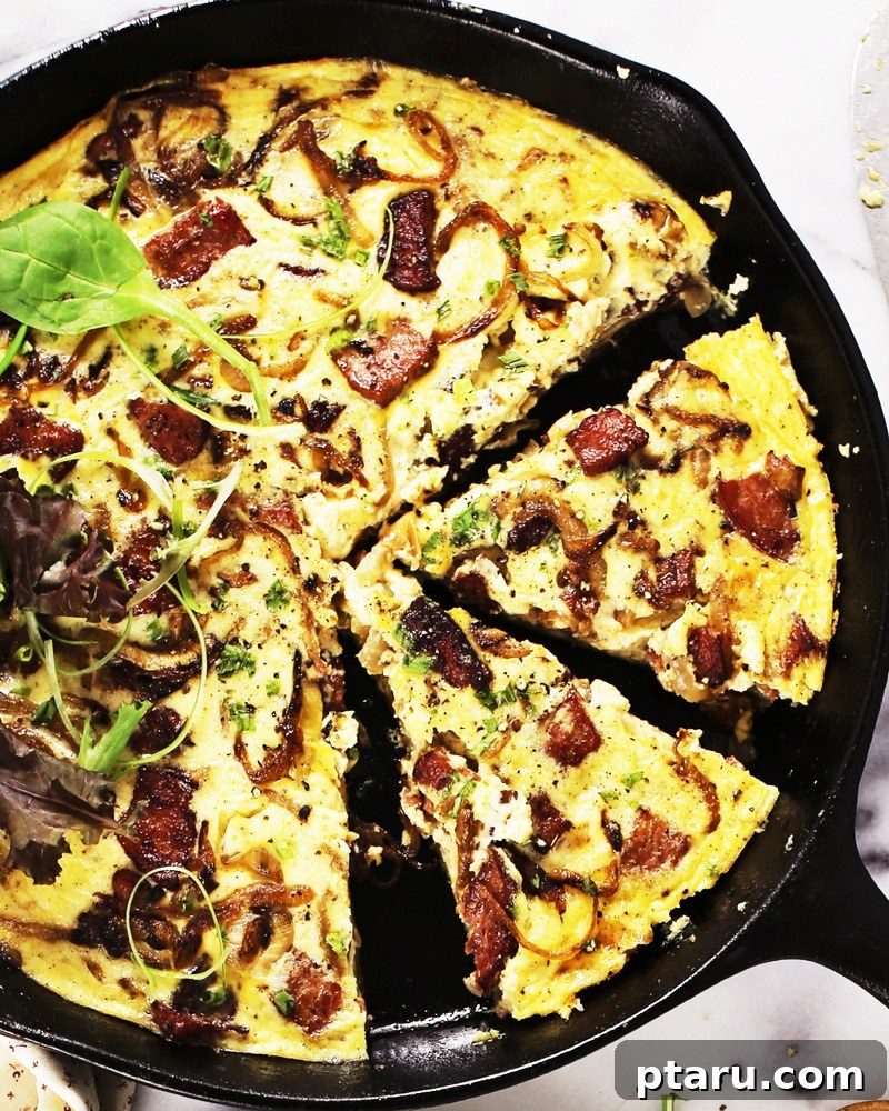 Golden Rosti Quiche: Sausage, Caramelized Onion, and Gruyere 6 The grated potato crust being pressed firmly into a skillet and starting to brown on the underside.