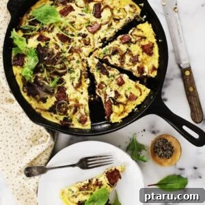 Potato-Crusted Turkey Sausage Quiche with Caramelized onions and Gruyere