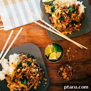 Close-up of Spicy Ground Pork and Vegetable Stir Fry with Peanut Sauce, beautifully arranged and garnished with chopped peanuts.