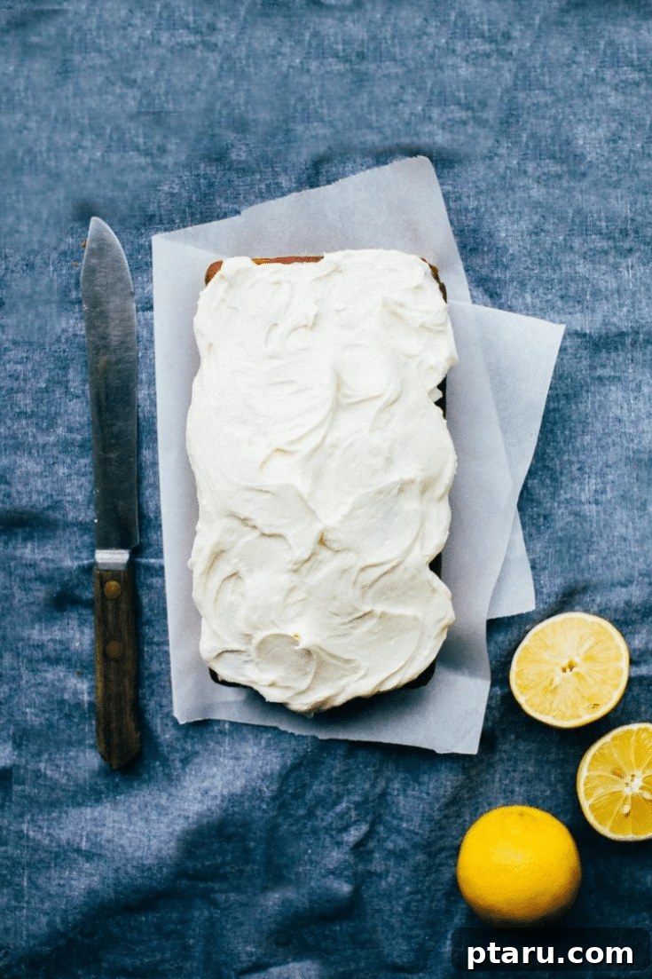 Sunshine Lemon Pound Cake 7 Beautifully decorated lemon pound cake loaf, with a description highlighting its moist, tender texture and suitability for guests.