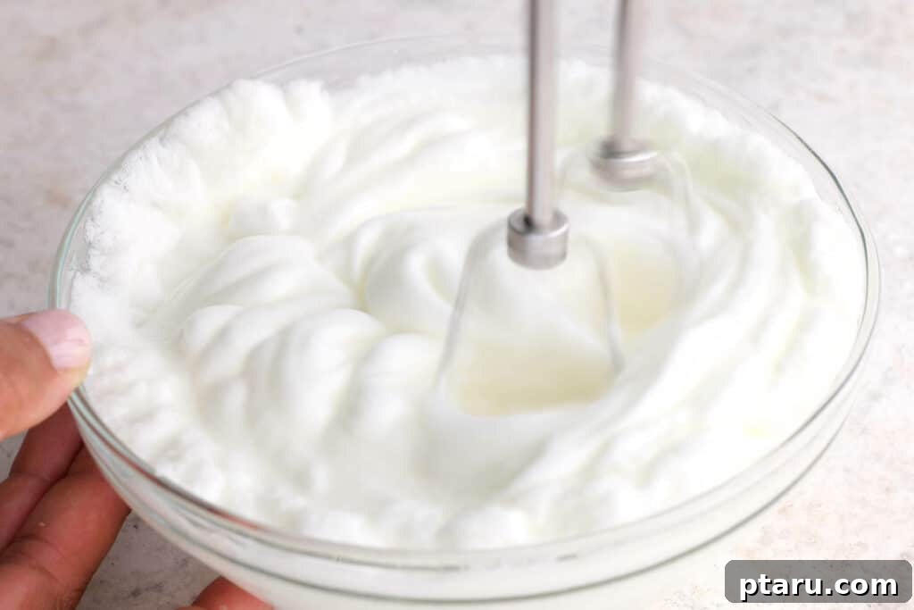 Mixing Batter Step 2: Creaming butter and sugar until light and fluffy.