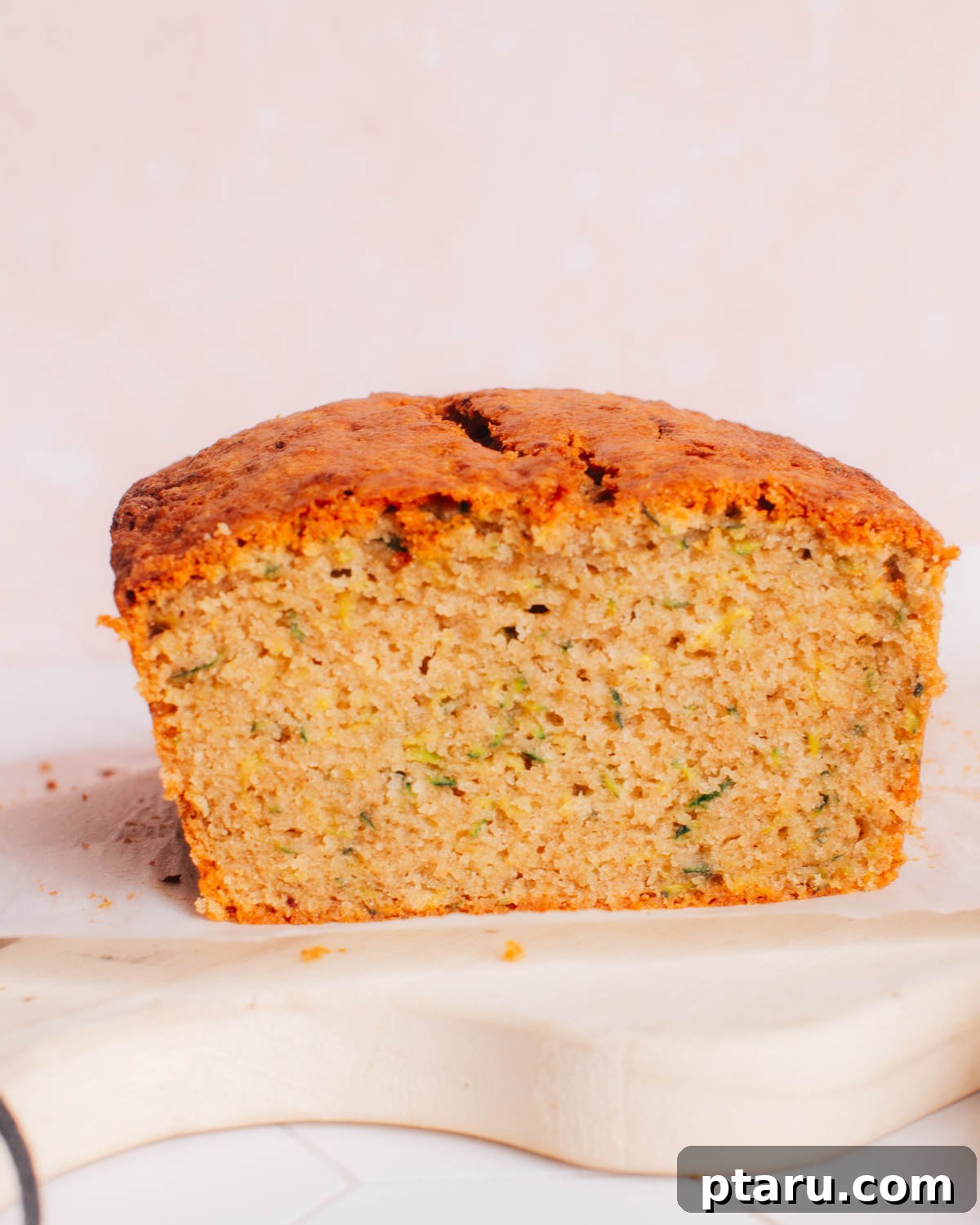 Ultimate Banana Zucchini Bread 3 Fresh ingredients including ripe bananas, grated zucchini, flour, and butter laid out for making banana zucchini bread.